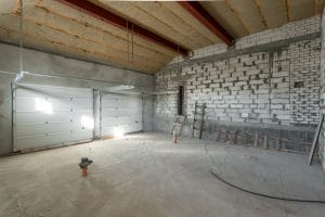 Large garage for two cars with of the gate overhaul and reconstruction Working process of warming inside part of roof House or apartment is under construction remodeling renovation restoration